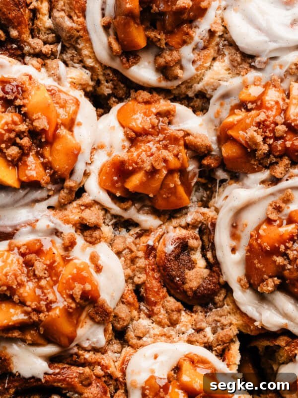 Apple Pie Cinnamon Rolls with Apple Cider Caramel Bottoms 15 Peach cobbler cinnamon rolls image