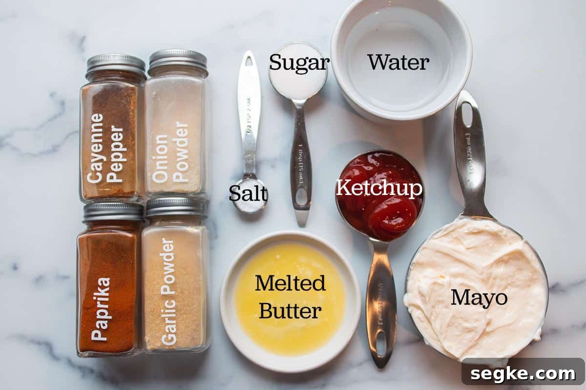 Ingredients laid out to make yum yum sauce. Water, sugar, salt, ketchup, mayo, melted butter and spices in spice jars. 