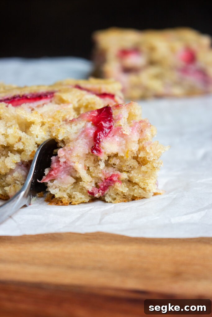 Slice of strawberry oatmeal breakfast cake on a plate