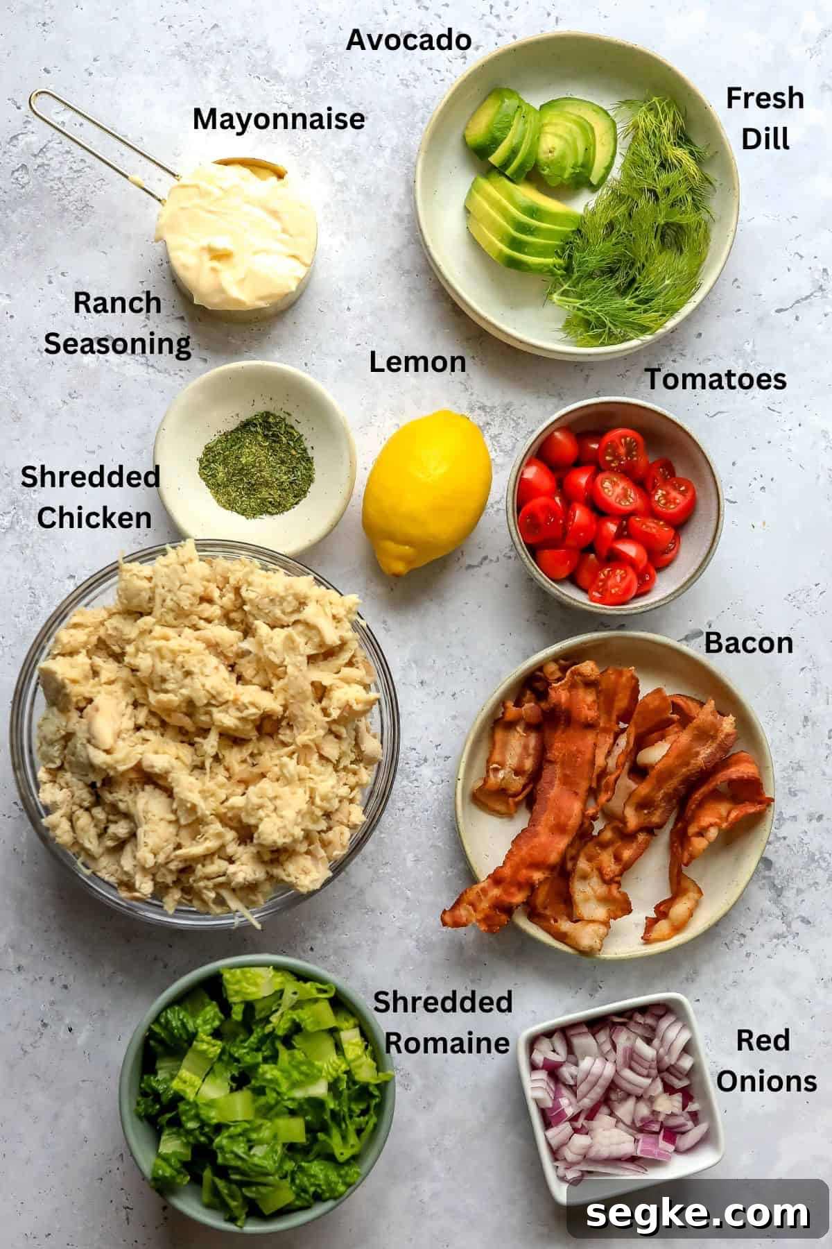 Ingredients to make this recipe on a countertop in bowls and a measuring cup. 