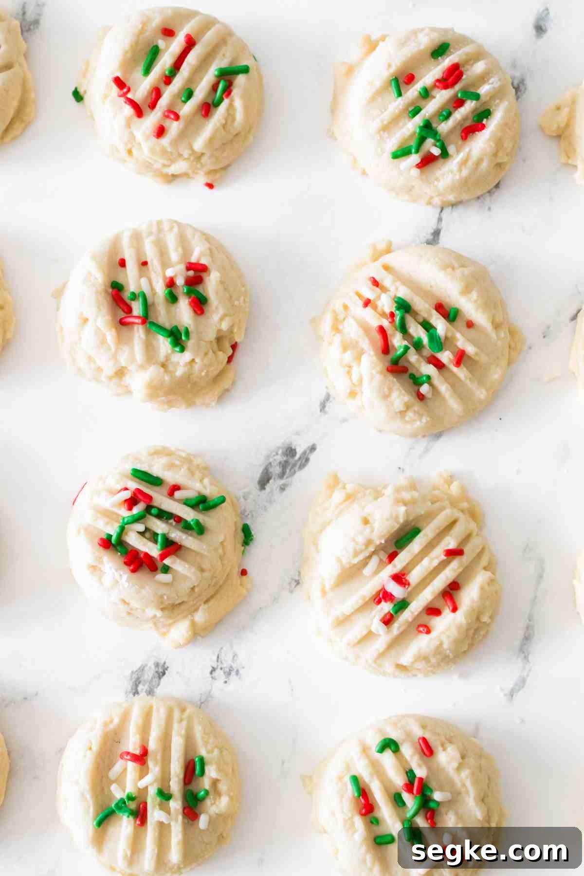 Light, Fluffy Whipped Shortbread Cookies Recipe 6 Whipped shortbread cookies with festive sprinkles.