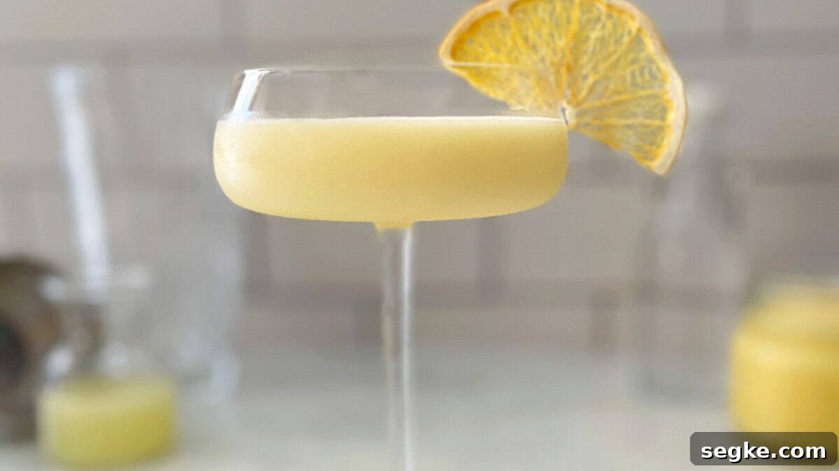11 Cocktail Recipes to Make at Home Instead of Going to the Bar 5 lemon curd cocktail in a coupe glass