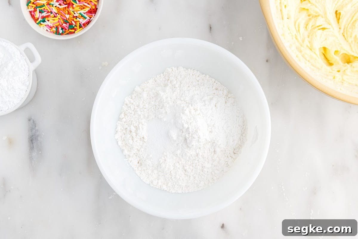 Funfetti Cake Recipe with Rainbow Sprinkles 6 Flour, baking powder, and salt in a mixing bowl.