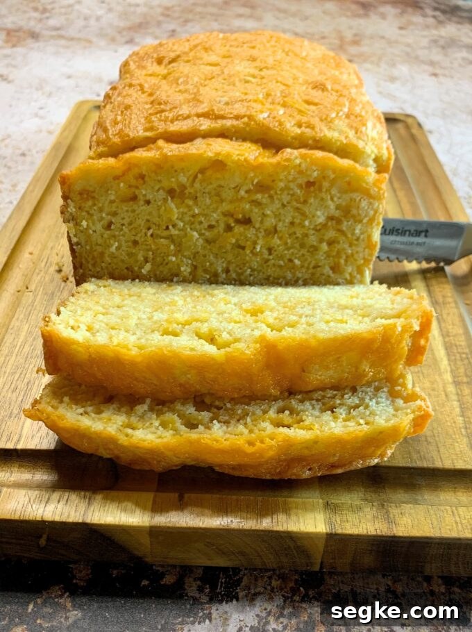 A sliced loaf of Cheddar Quick Bread.
