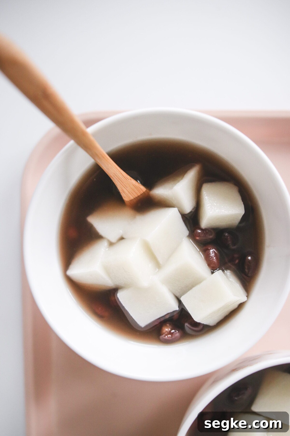 Japanese Zenzai Recipe: Sweet Red Bean Soup 2 a bowl of zenzai topped with mochi.