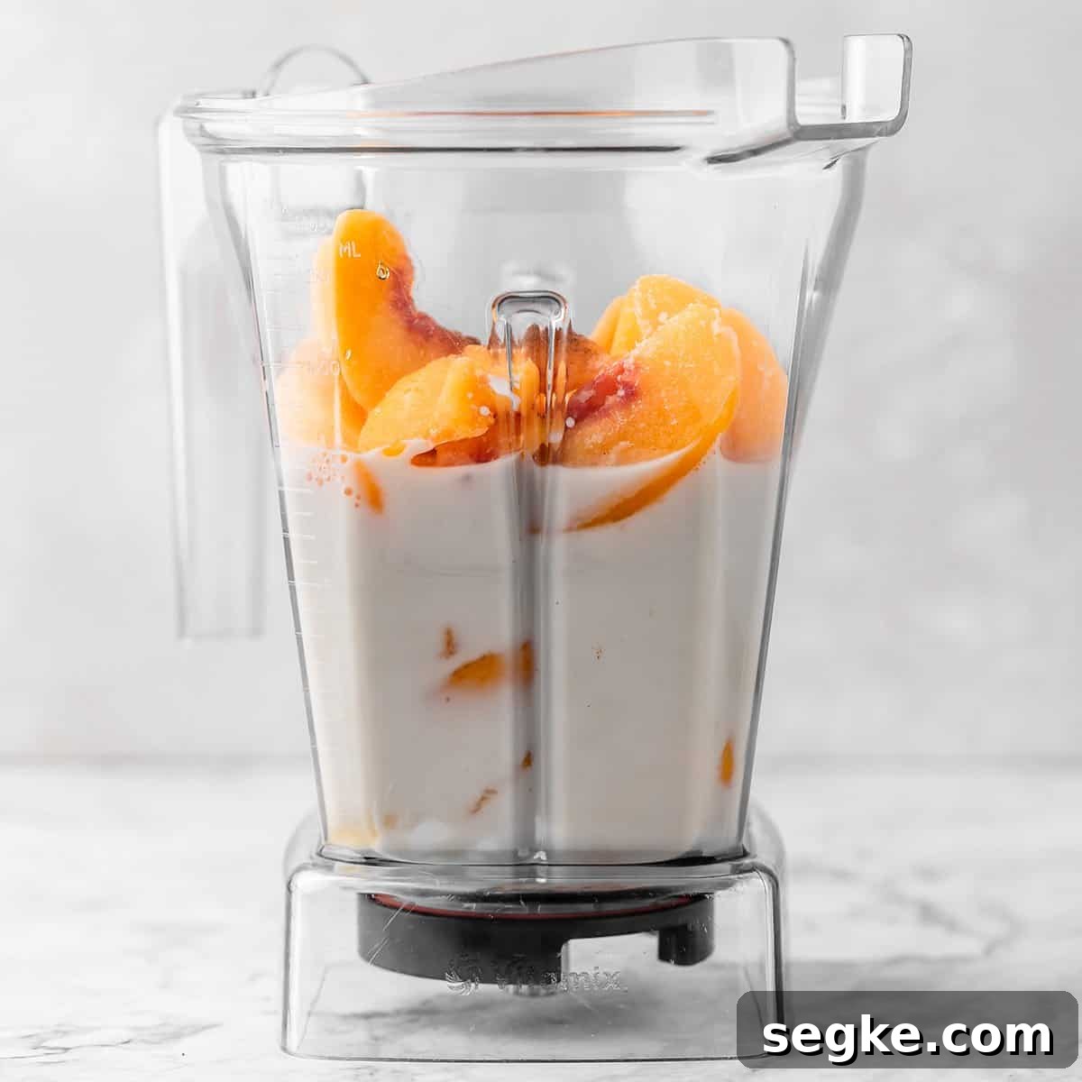 the ingredients in this Peach Smoothie Recipe in a blending container before blending