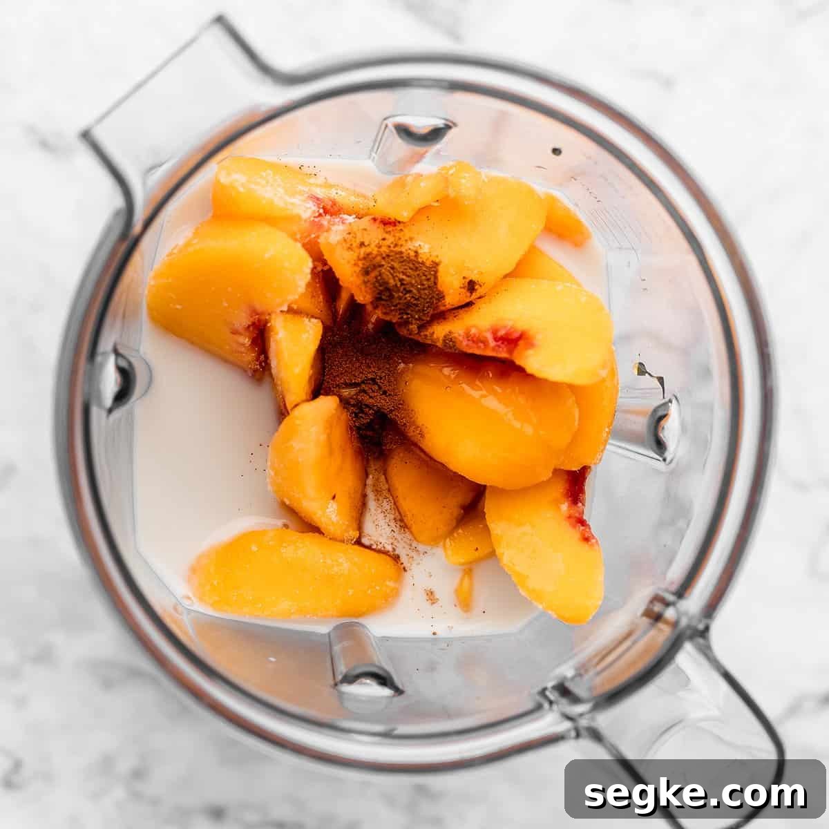 the ingredients in this Peach Smoothie Recipe in a blending container before blending