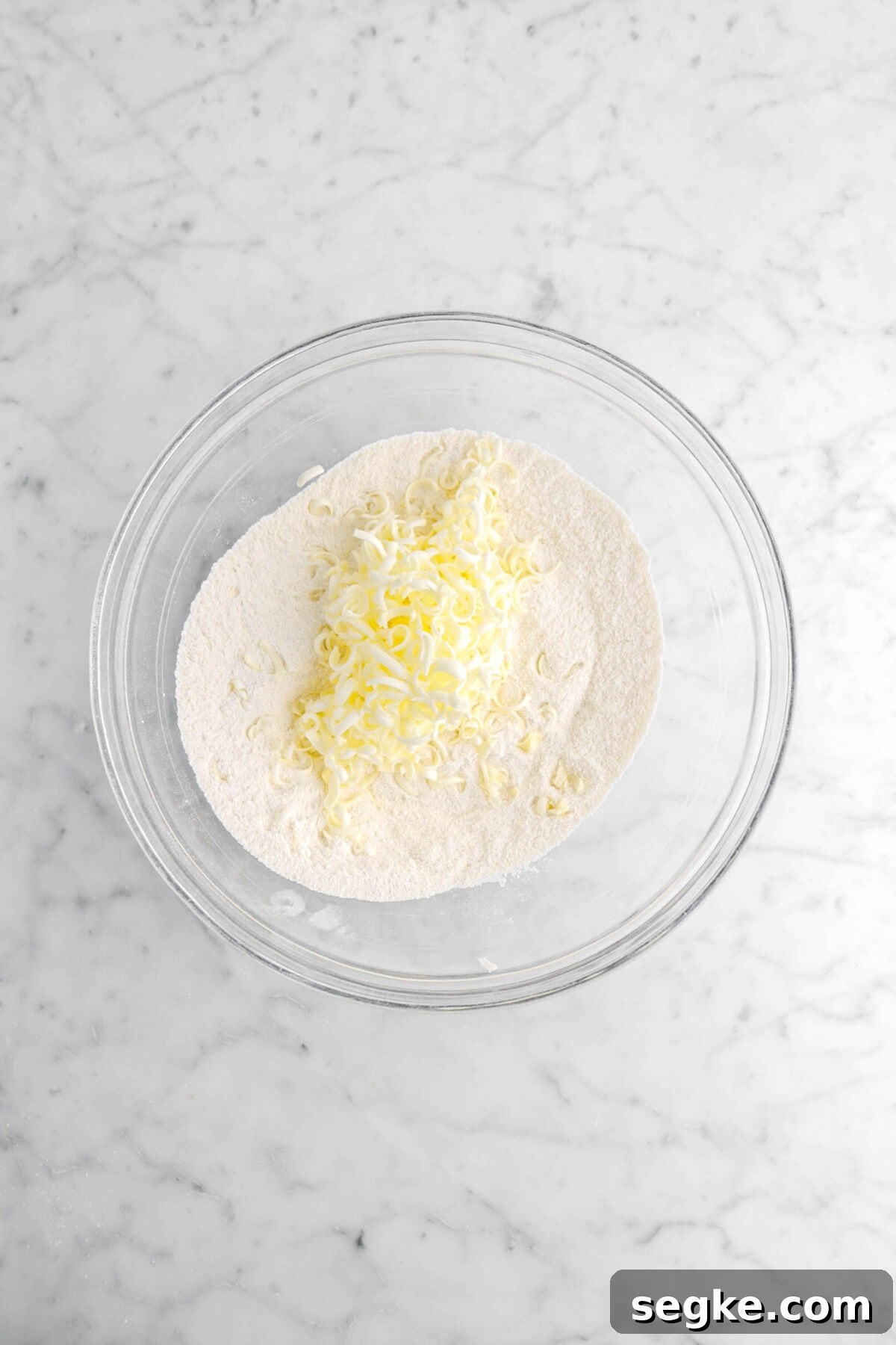 grated butter added on top of dry ingredients.
