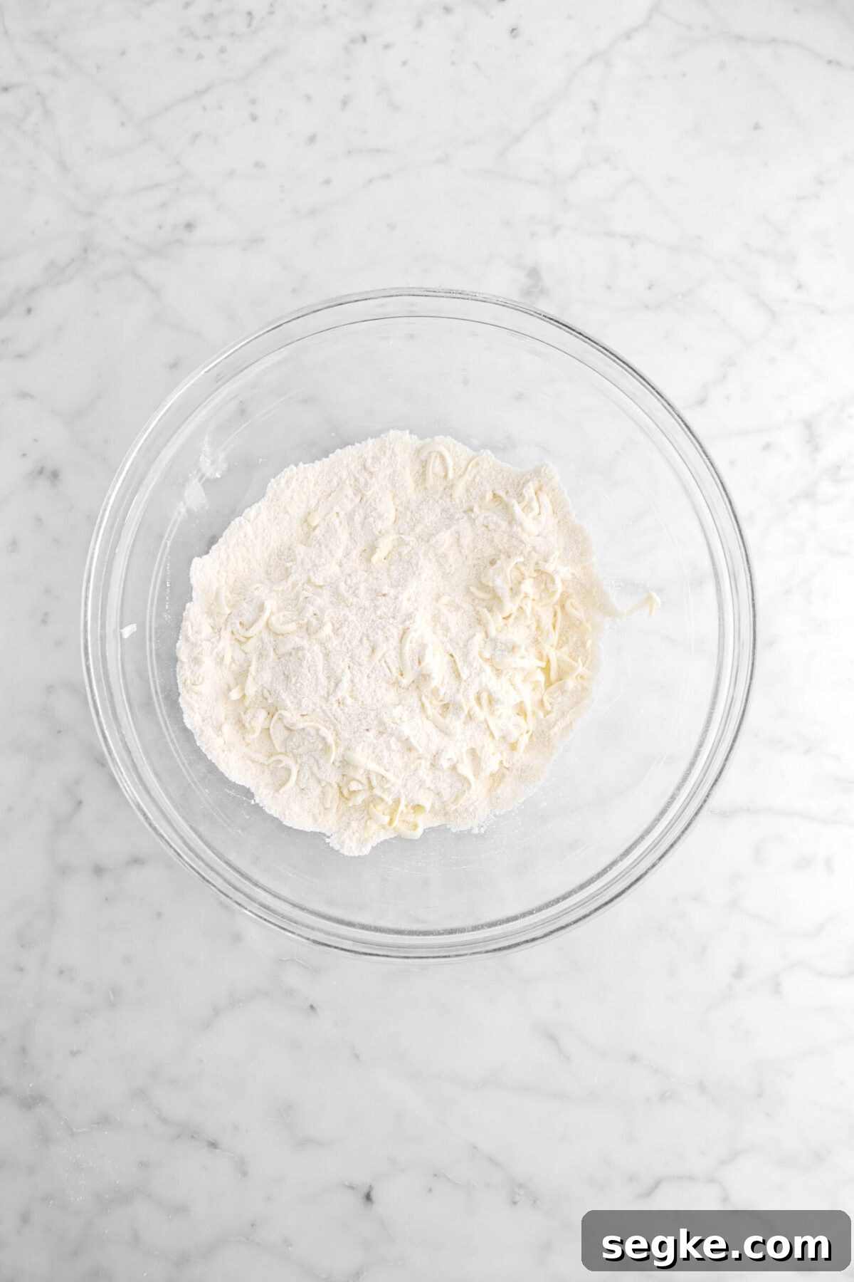 grated butter mixed into dry ingredients.