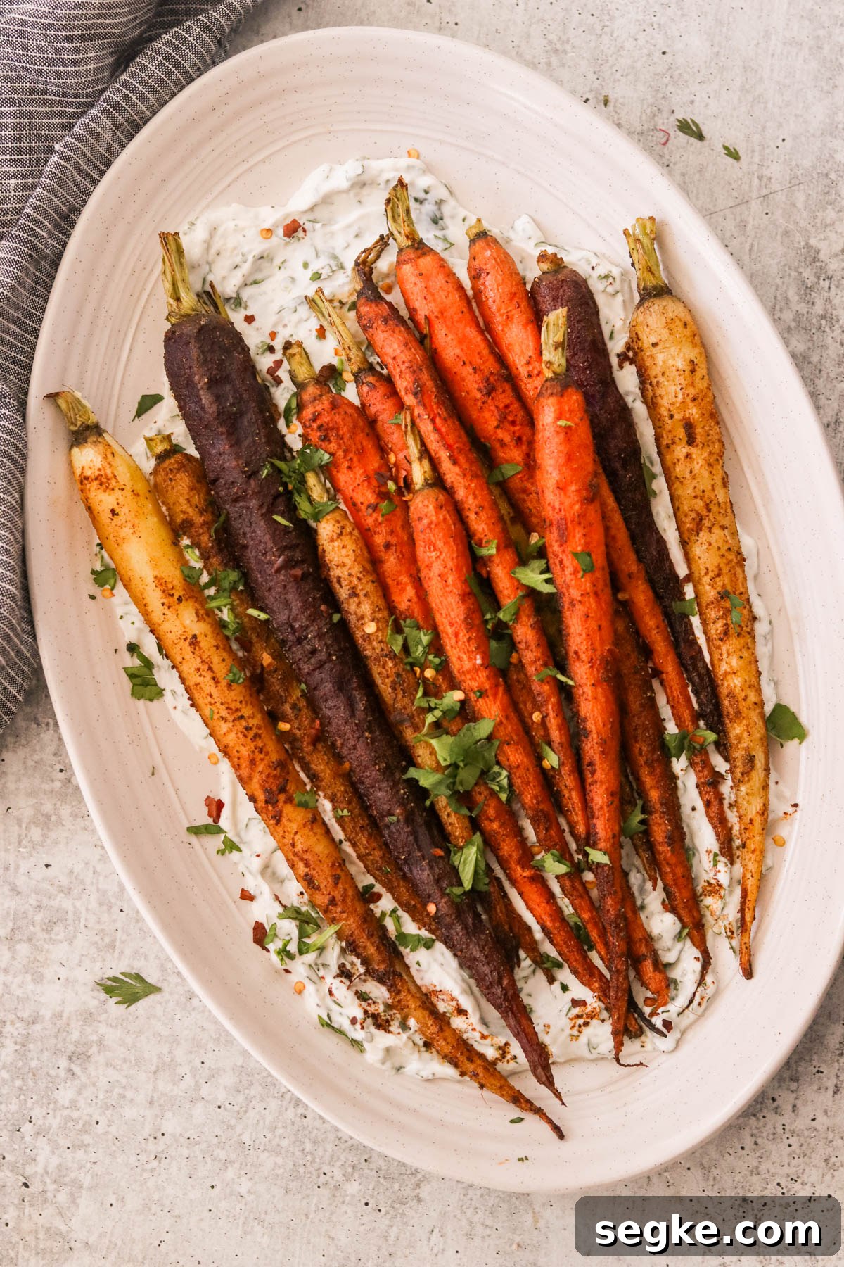 colorful moroccan spiced carrots on a white serving platter 