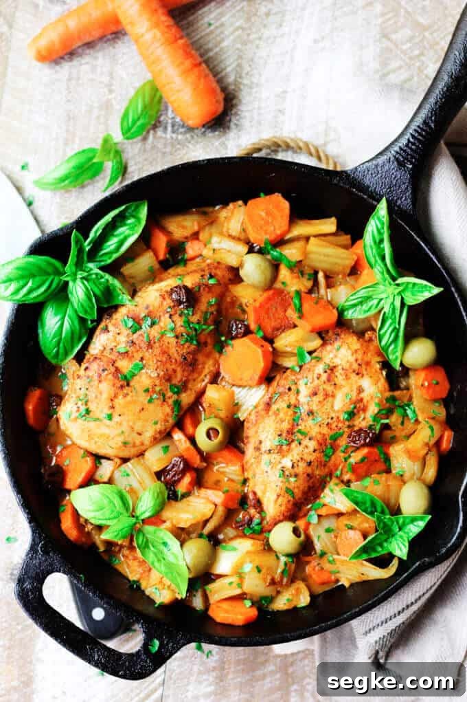 Fennel Chicken Mediterranean Style with carrots, raisins, and olives is a very easy, one-pot meal for any day of the week. It is seasoned with cinnamon, cumin and smoked paprika for an irresistible and flavorful chicken dish. Fennel Chicken with carrots, raisins and olives in cast iron pan