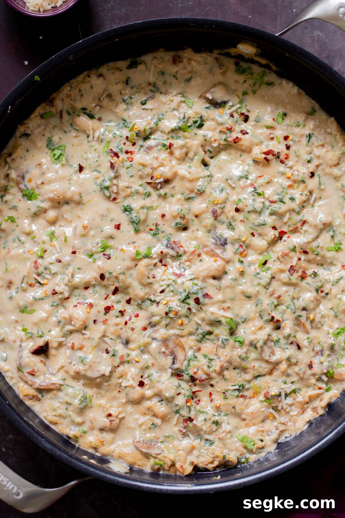 One-Pan Tuscan White Bean Skillet Recipe 2 pan of tuscan beans on a slate table