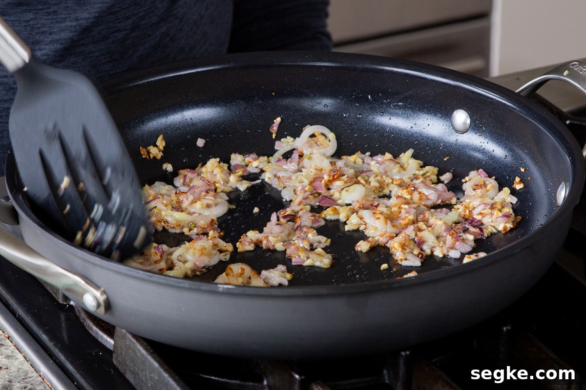 One-Pan Tuscan White Bean Skillet Recipe 6 garlic and onions in the pan, after cooking