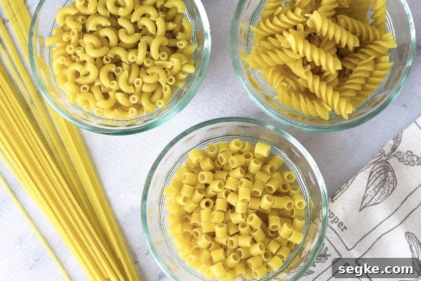 Instant Pot Pasta Recipe: Perfect Al Dente Every Time 4 three glass bowls filled with dry pasta