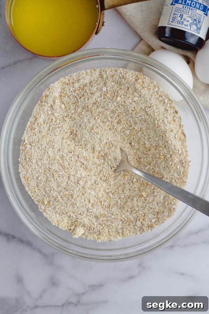 almond flour, oat flour and confectioners' sugar mixed together in a bowl