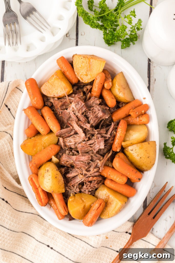 serving platter with pot roast, potatoes, and carrots