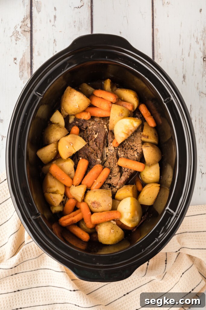 pot roast with potatoes and carrots in crock pot