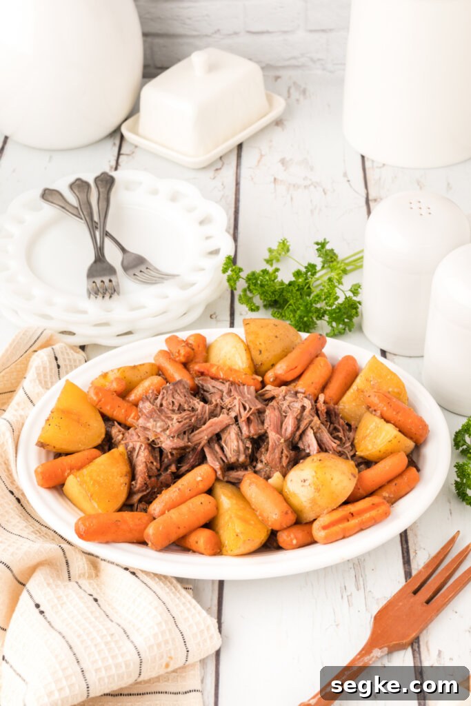 pltter with old fashioned pot roast and potatoes and carrots