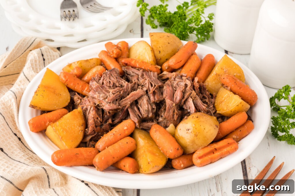 pot roast with potatoes and carrots on serving platter