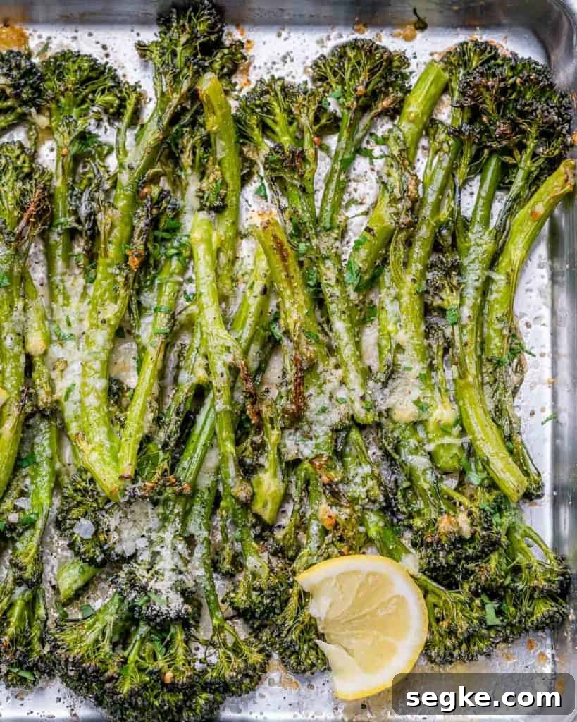 top view of roasted broccolini on a baking pan
