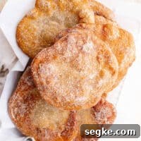 overhead view of elephant ears pastry stacked in a basket.