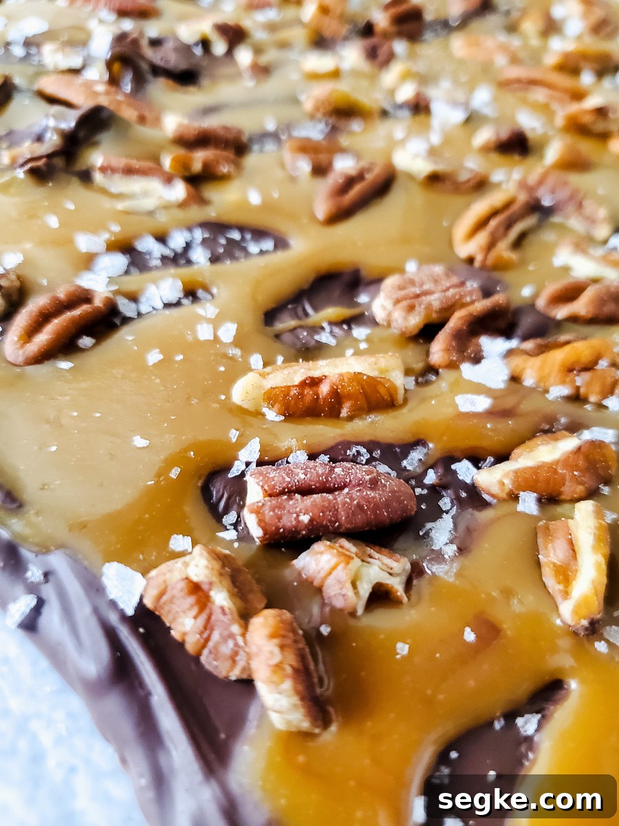 Salted Caramel Chocolate Turtle Bark with Pecans 2 Closeup picture of caramel pecan Turtle bark.