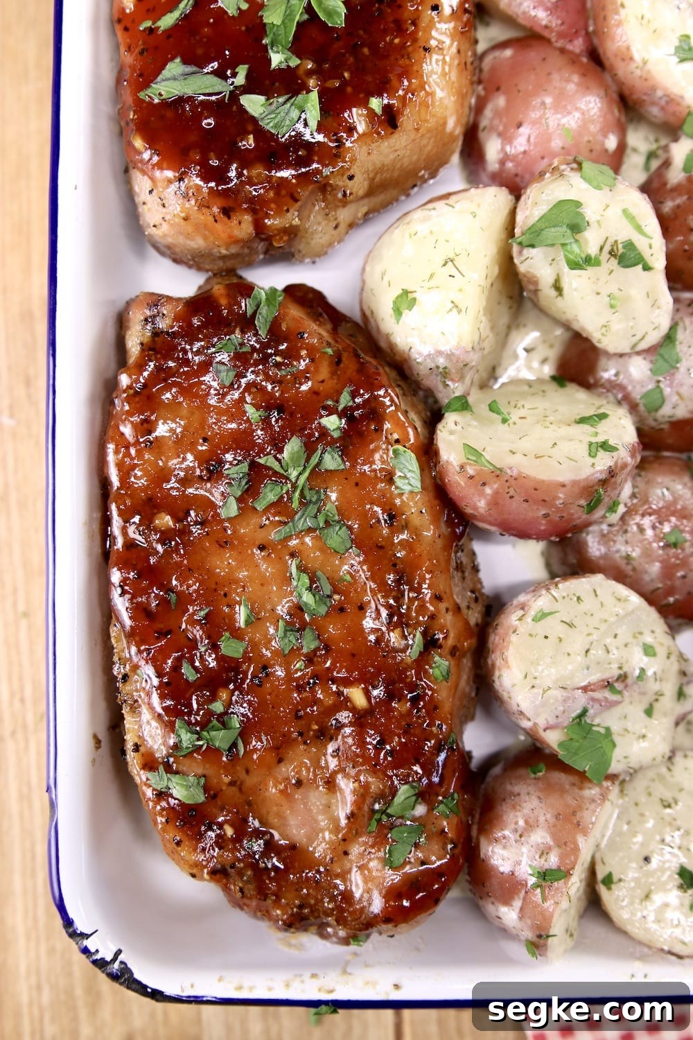 Barbecue pork chops on a platter with potatoes