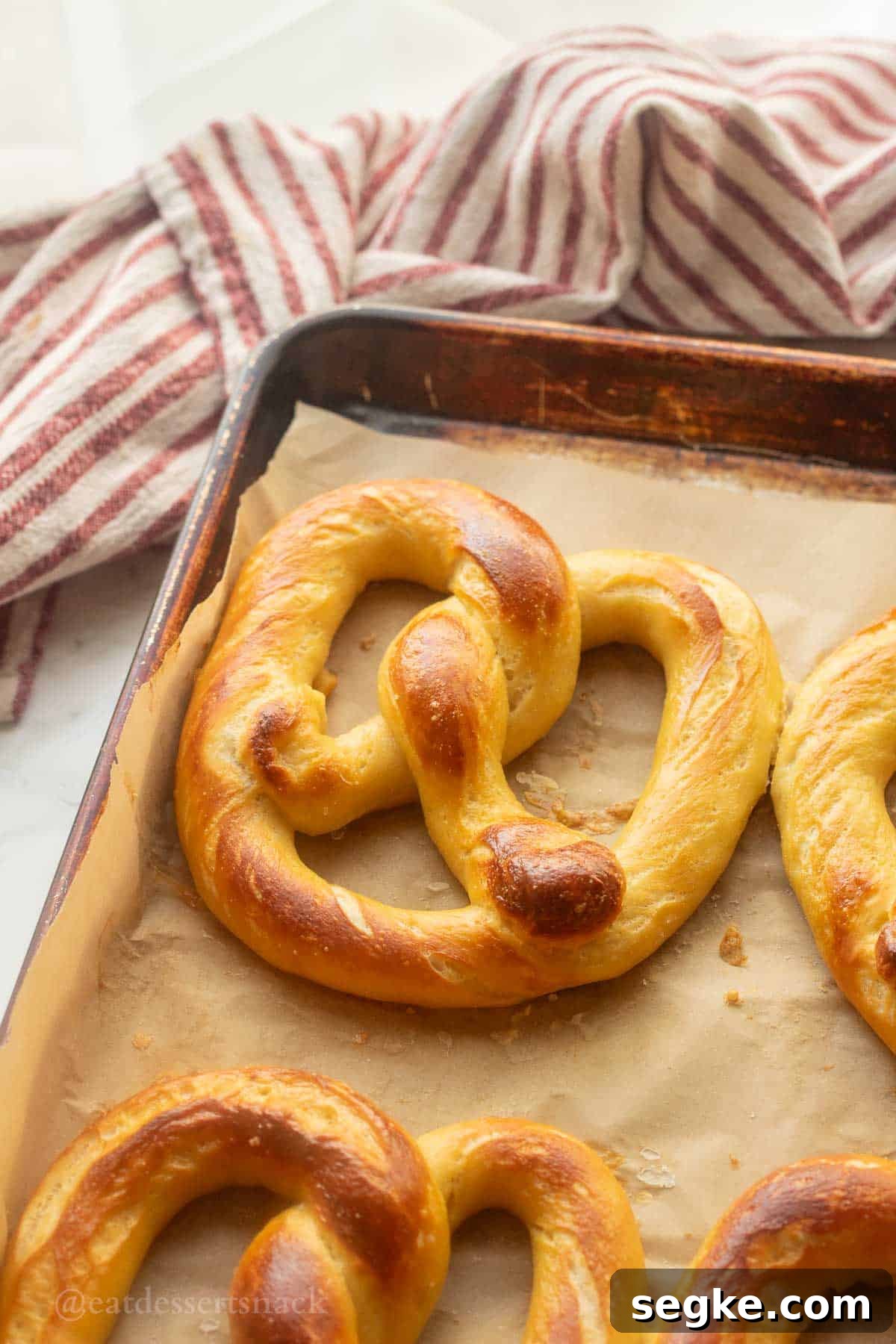 Homemade Soft Baked Amish Pretzels Recipe 2 Baked pretzel on baking sheet.