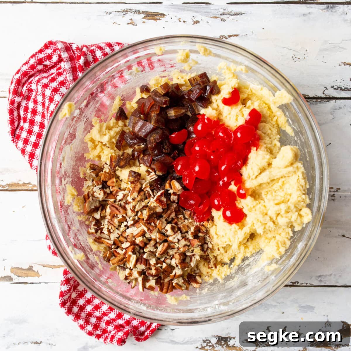 chopped pecans, dates, and maraschino cherries in a cherry wink cookie dough