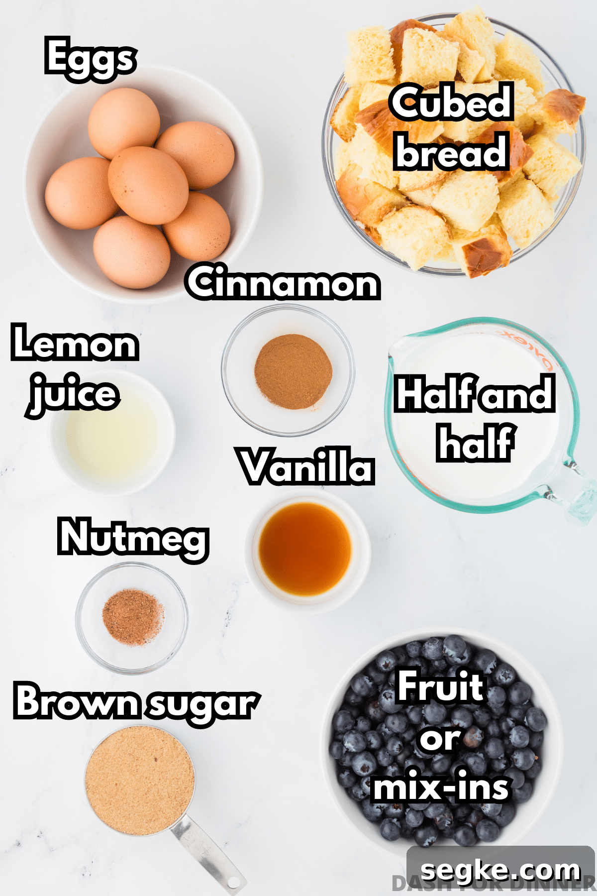 The ingredients needed to make baked French toast: eggs, bread, half and half, fruit, brown sugar, etc.