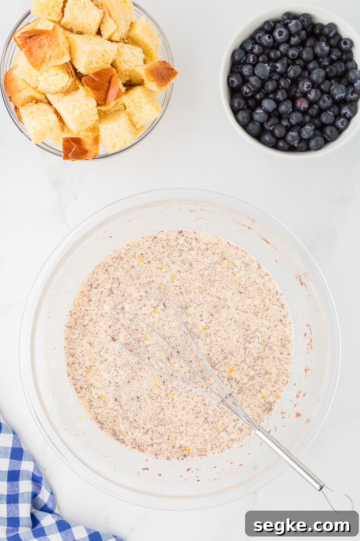 A bowl full of custard mixture for French toast.