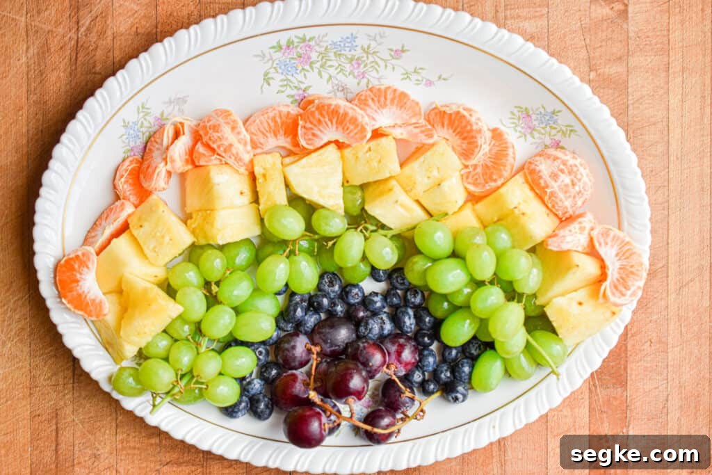 The oranges are added to the platter.