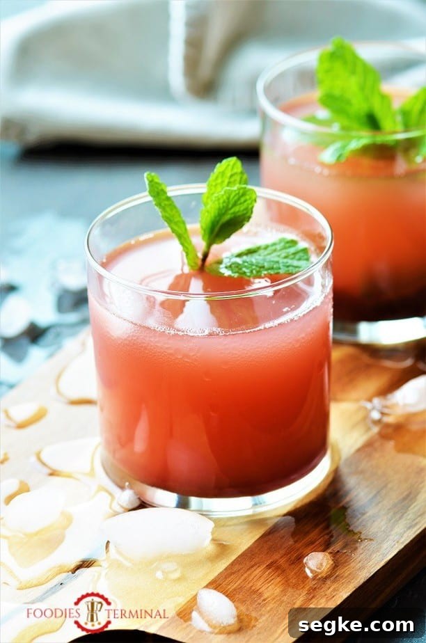 Kokum Sharbat served in transparent glass with ice cubes