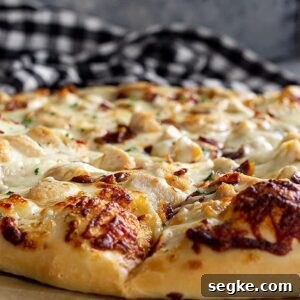 Crispy Chicken Bacon Ranch Pizza Recipe 7 Close up of pizza crust showing the lightly browned melty cheese.