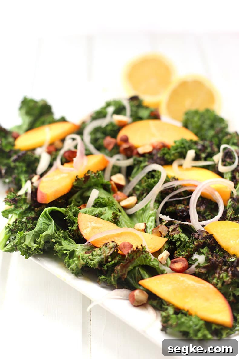 Grilled kale salad with peaches and hazelnuts