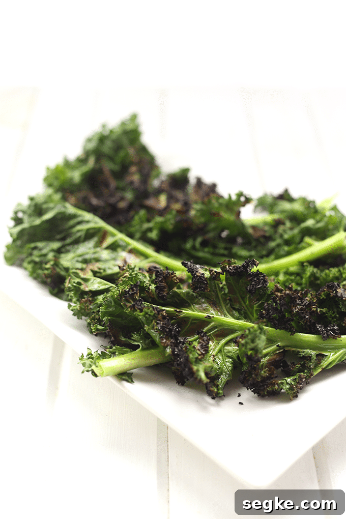Grilled kale pieces topped with peaches and hazelnuts