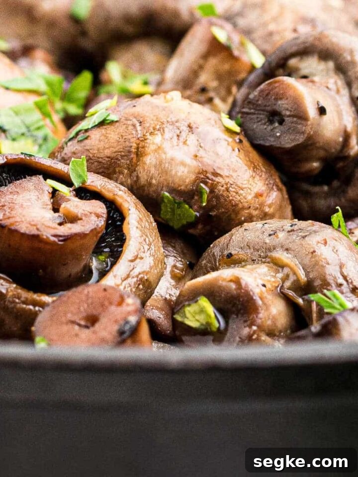 How to Smoke Asparagus: Tender, Smoky Grilled Spears 6 close up of some smoked mushrooms in a cast iron pot.