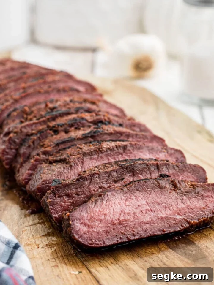 How to Smoke Asparagus: Tender, Smoky Grilled Spears 8 smoked venison backstrap sliced on a board