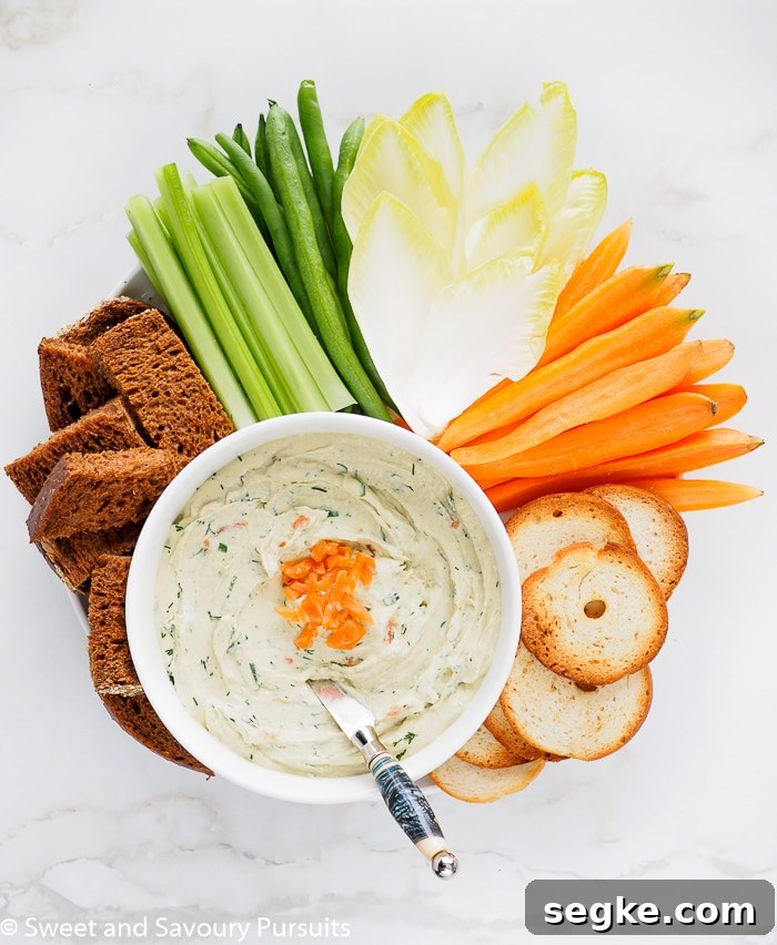 Smoked Salmon and Cream Cheese Dip 2 Smoked Salmon Cream Cheese Dip served with vegetables, pumpernickel bread, and bagel crisps