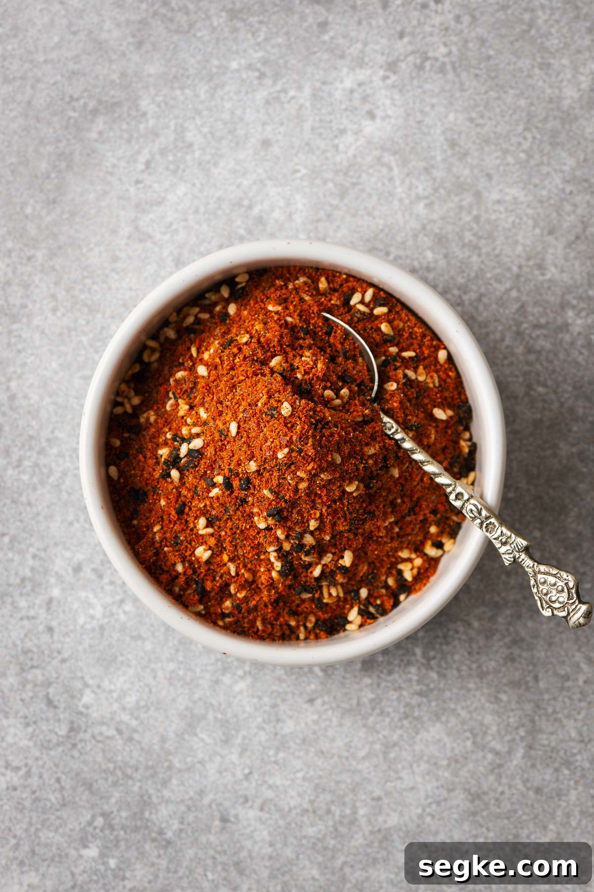 Shichimi Togarashi: Authentic Japanese Seven-Spice Seasoning 10 Japanese seven spice in a bowl with a small spoon.