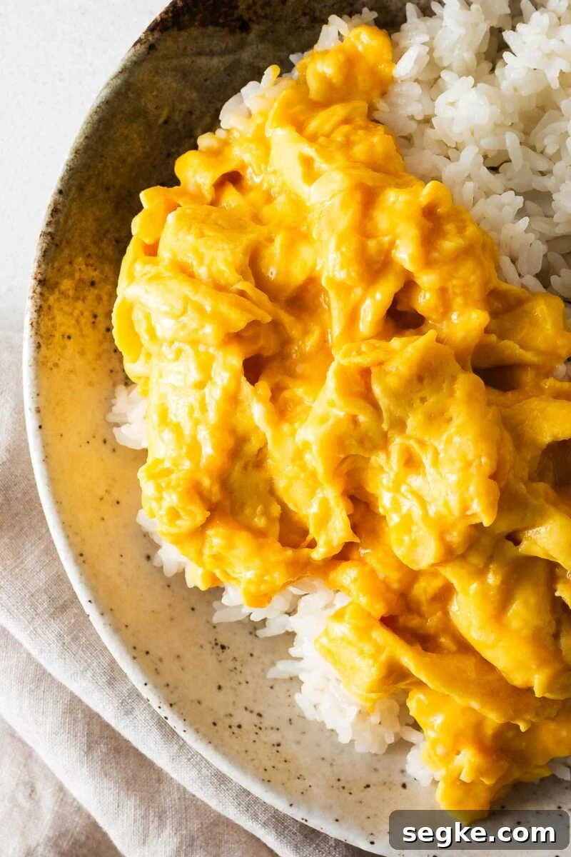 Large curds of creamy miso scrambled eggs viewed up close.