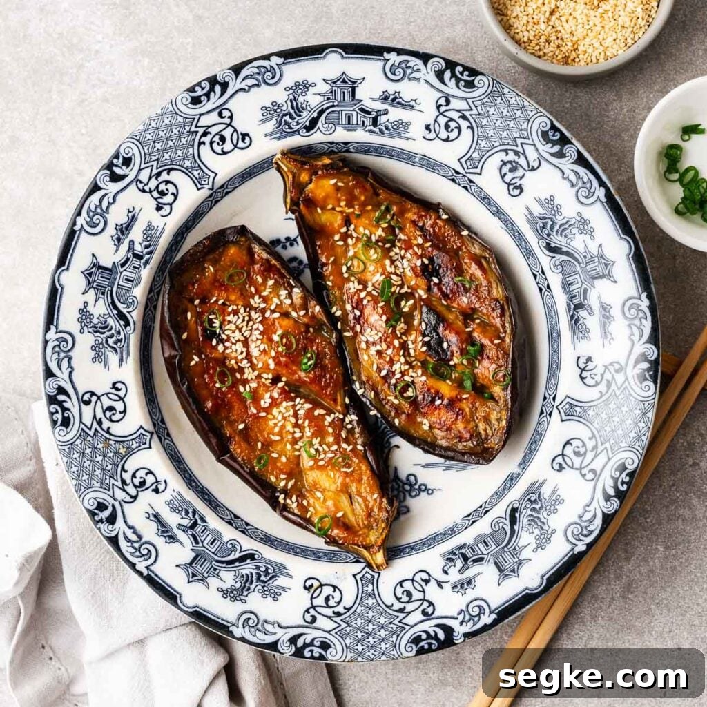 Nasu dengaku (eggplant sliced in half and grilled with miso sauce) in a traditional Japanese ceramic bowl.