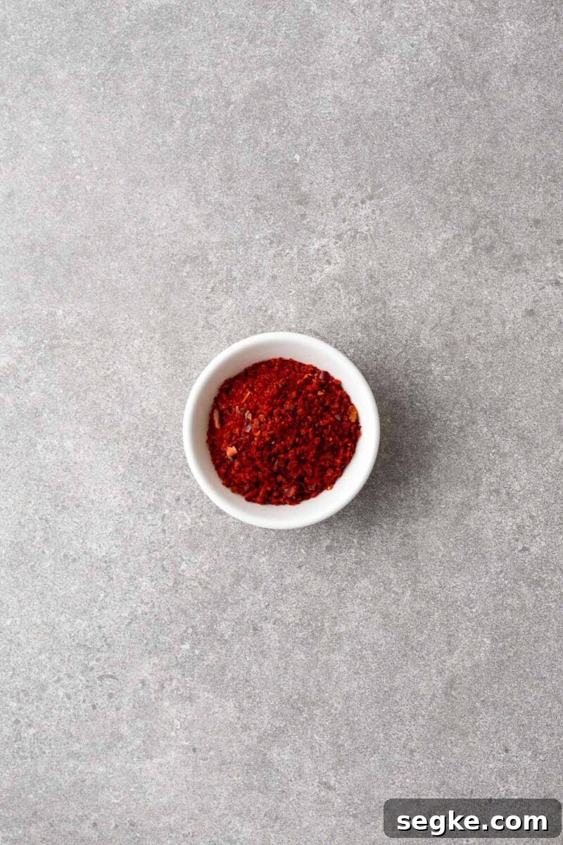 Shichimi Togarashi: Authentic Japanese Seven-Spice Seasoning 2 A small bowl with gochugaru flakes (Korean red pepper flakes).