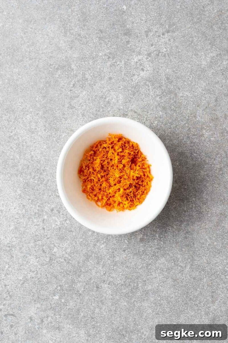 Shichimi Togarashi: Authentic Japanese Seven-Spice Seasoning 5 Dried orange zest in a small white bowl.