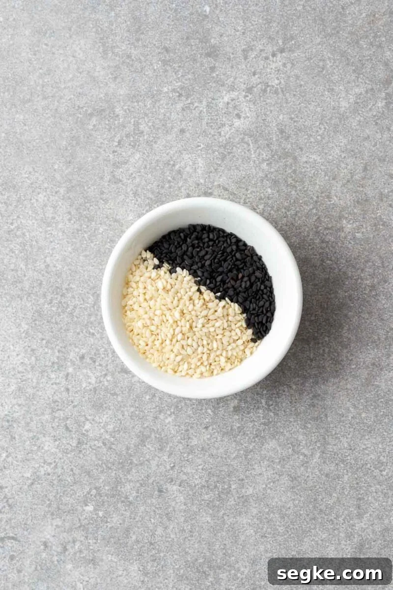 Shichimi Togarashi: Authentic Japanese Seven-Spice Seasoning 6 Black and white sesame seeds in a small white bowl.