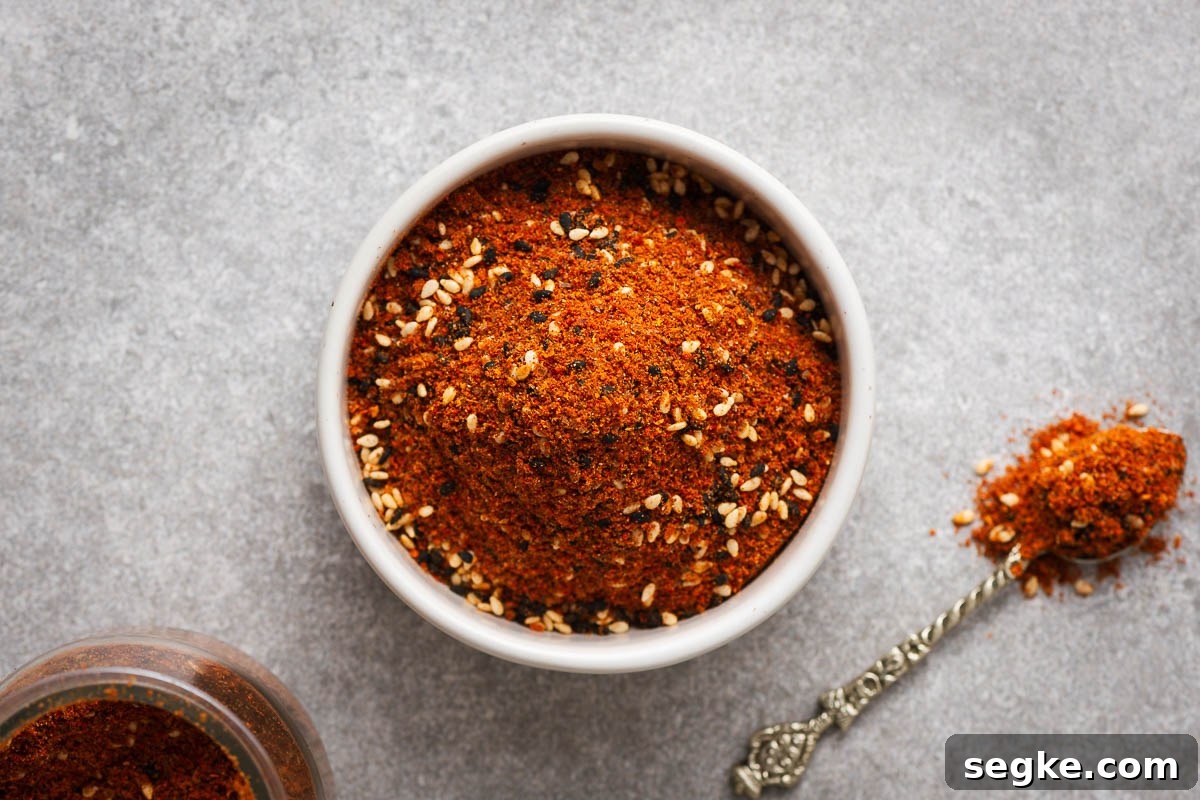 Shichimi Togarashi: Authentic Japanese Seven-Spice Seasoning 9 Nanami togarashi in a small bowl with a spoon next to it.