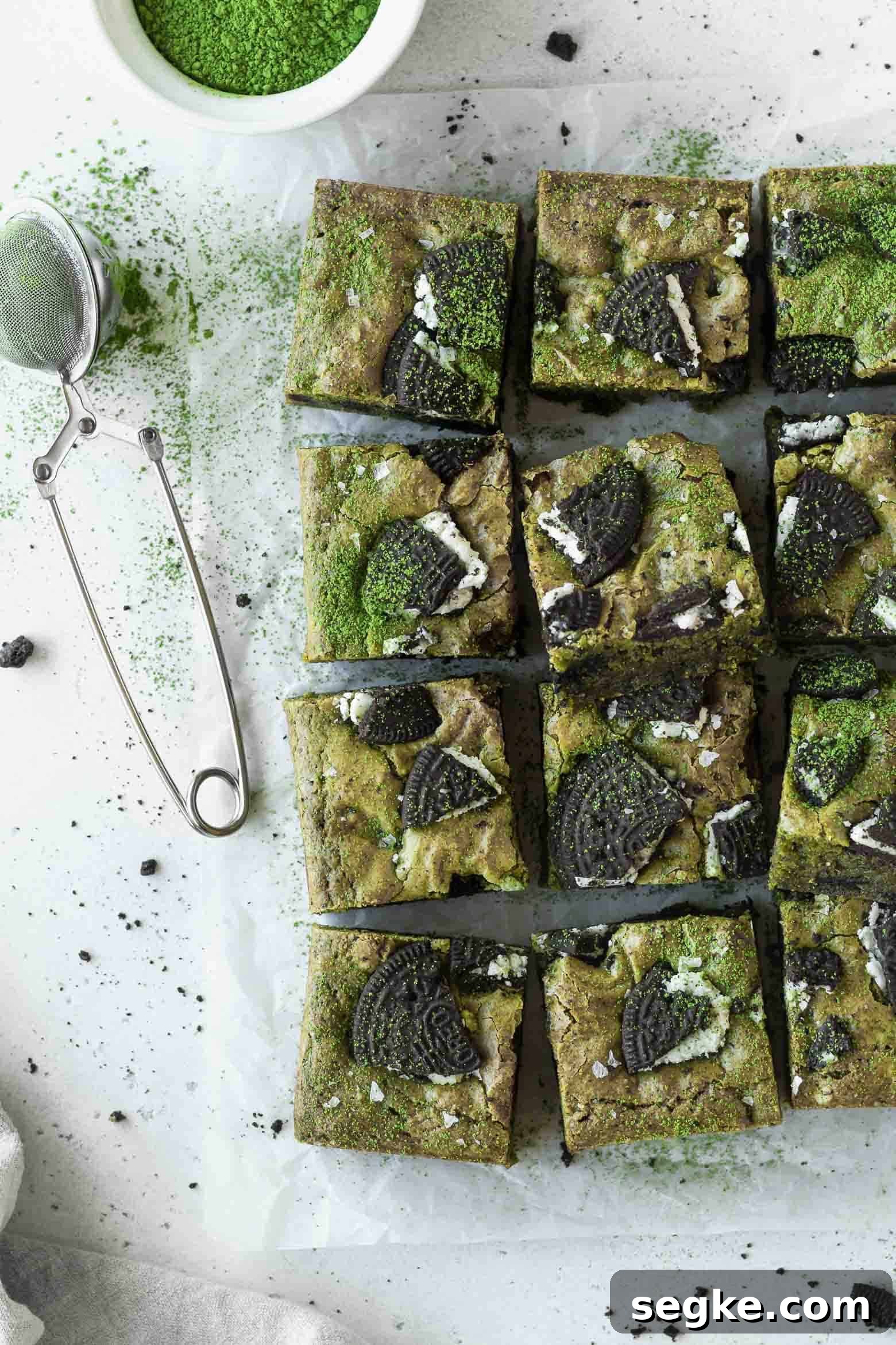 Squares of matcha blondies on a parchment paper