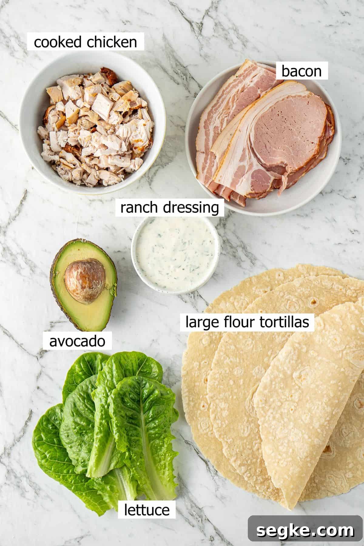 All ingredients needed to make chicken bacon ranch wraps laid out in bowls.