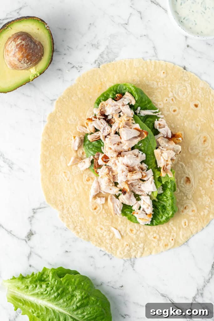 Adding the fillings to the wrap.