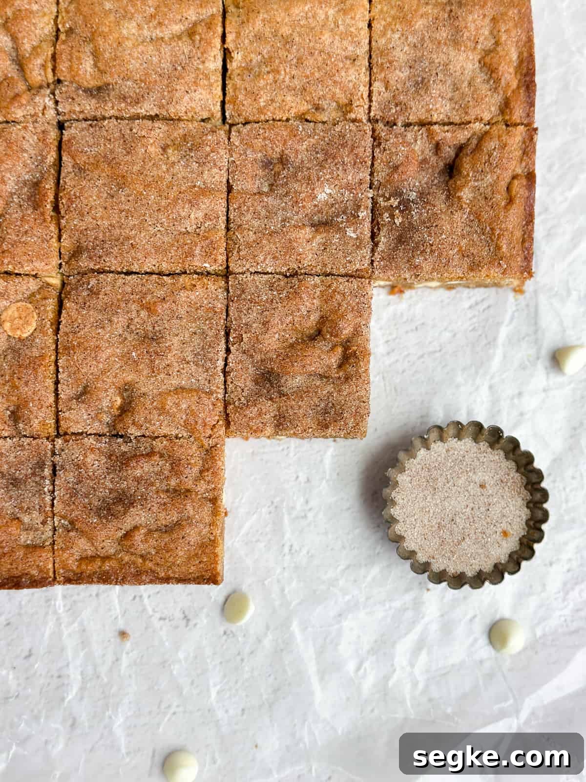 Gingerbread Blondies Recipe: Molasses-Spiced Chewy Bars 8 a close up of some gingerbread blondies cut up.